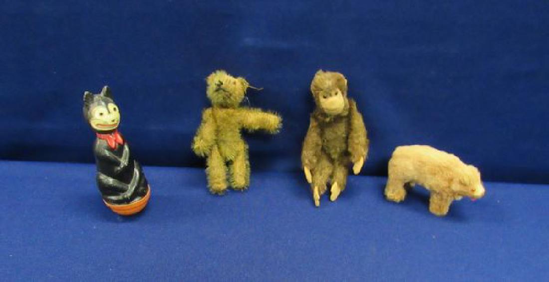 (4 PIECE) VINTAGE TOY LOT:: 4 IN. GLASS EYED MOHAIR BEAR, 4 1/2 IN. GLASS EYED MOHAIR MONKEY, 3 IN. GLASS EYED BEAR PLUS 4 IN. CELLULOID BLACK CAT ROLY-POLY - CONDITIONS VARY - FAIR TO GOOD