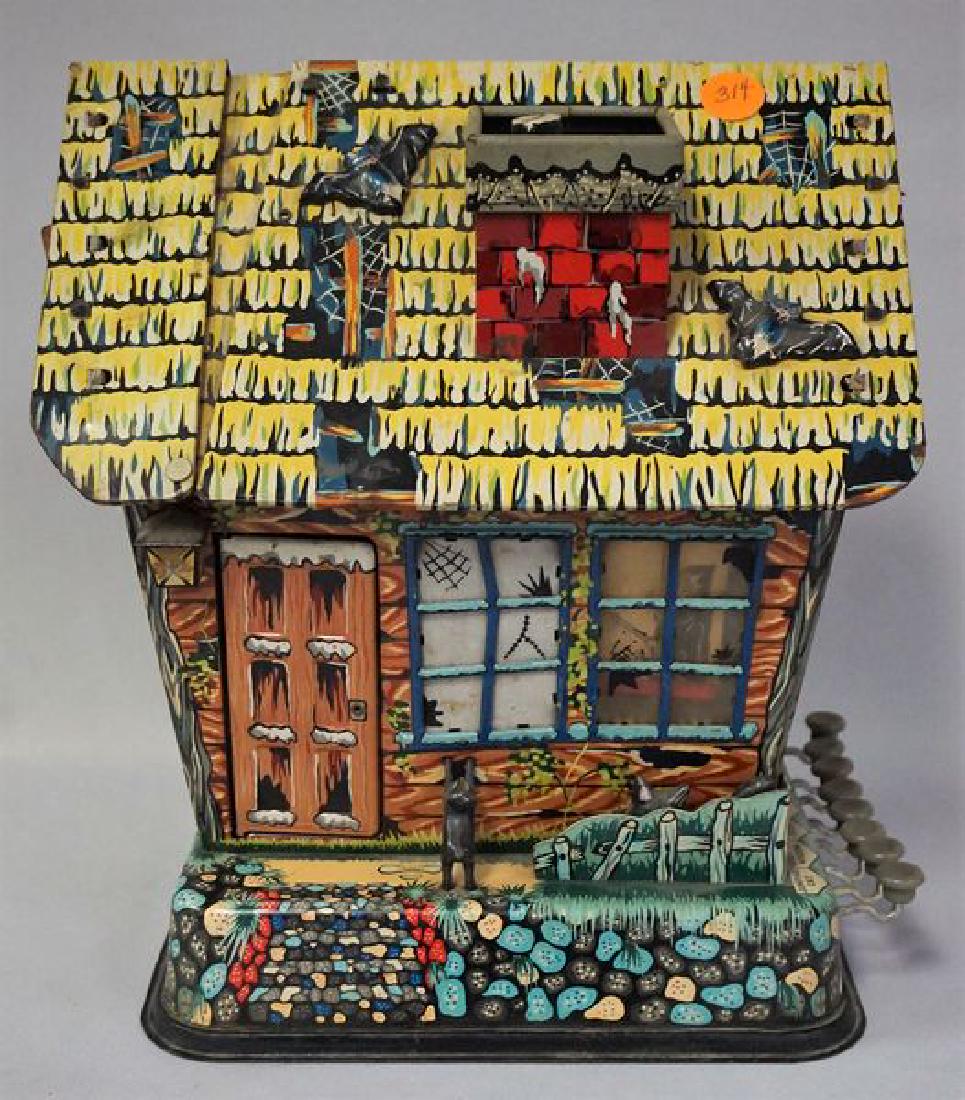 MARX TIN LITHO HOOTIN HOLLOW HAUNTED: HOUSE: APPROX. 10 IN. W, 7 IN. D, 10 3/4 IN. H, BATTERY OPERATED BUT PRESENTLY NOT WORKING, DOES NOT PRODUCE ANY SOUND(S), MECHANICAL FUNCTIONS WORKING INCLUDE THE JUMPING CAT, FRONT DOOR WILL NOT OPE