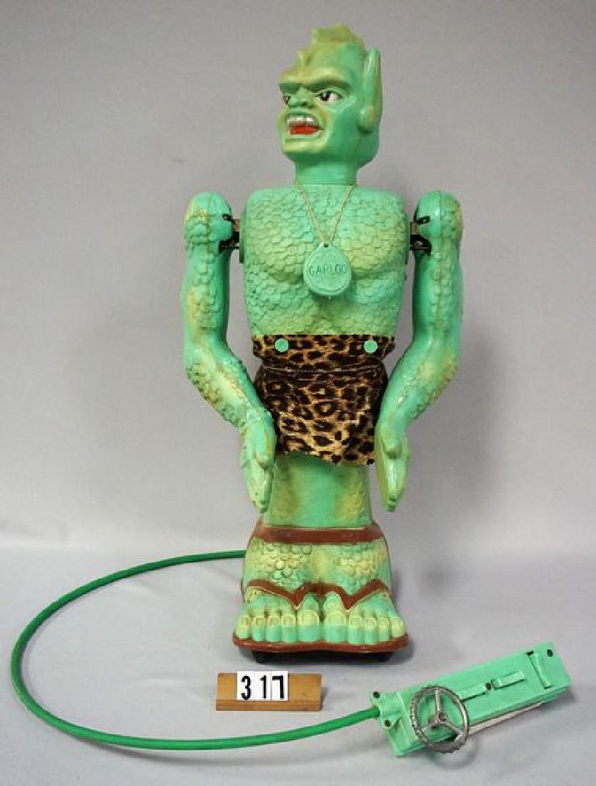 MARX 'THE GREAT GARLOO': 22 IN. TALL HARD PLASTIC FIGURE WITH ATTACHED REMOTE CONTROL / BATTERY BOX, WORKING FUNCTIONS INCLUDE MOVING FORWARD & BACKWARD, STEERING CONTROL, BODY BENDS UP & DOWN, ARMS DO NOT OPEN OR CLOSE, FOAM