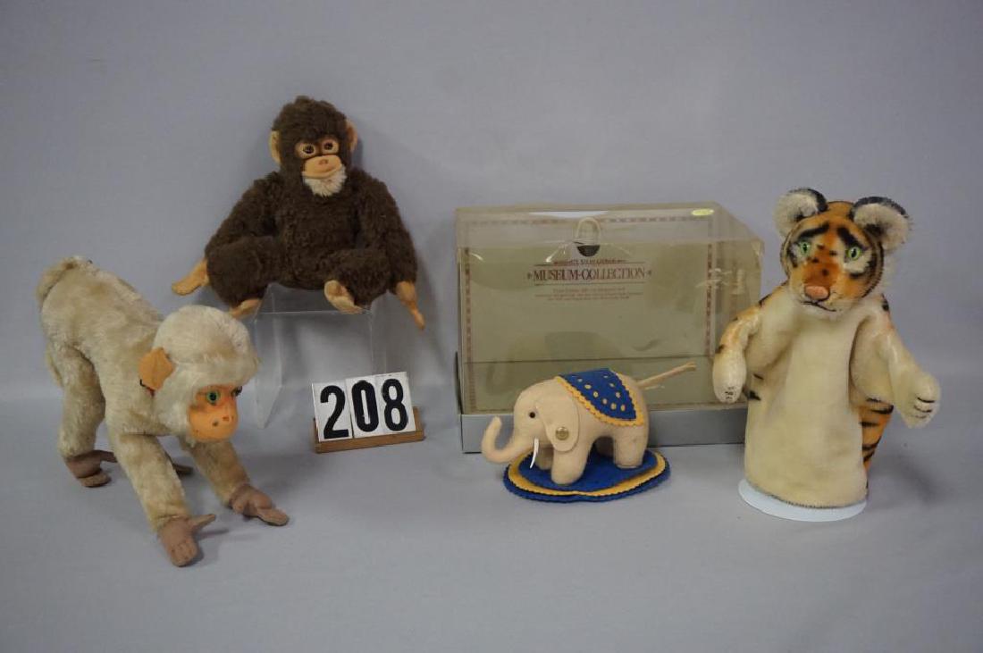 (4 PIECES) STEIFF: MUSEUM COLLECTION 1880 3 1/2 IN.: (4 PIECES) STEIFF: MUSEUM COLLECTION 1880 3 1/2 IN. ELEPHANT - EX WITH ORIGINAL BOX, PLASTIC COVERING IS YELLOWED, HAS SPLITS, ETC - AS-IS, CARDBOARD PORTION OF BOX IS VG, 8 1/2 IN. TIGER GLOVE PUPPET