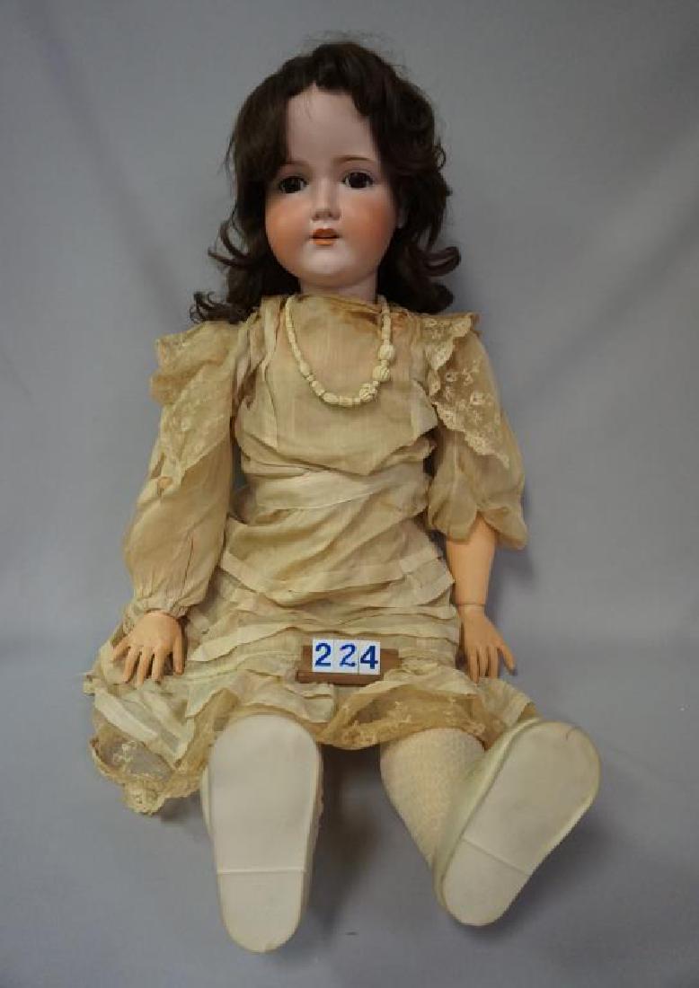 A 18 M 38 INCH BISQUE SOCKET HEAD CHILD WITH B.J. COMPO: A 18 M 38 INCH BISQUE SOCKET HEAD CHILD WITH B.J. COMPO & WOOD BODY, SLEEP EYES, WAX MISSING OVER LEFT EYE, SLIGHT HAIRLINE OVER LEFT EYE NEAR TOP OF CROWN, SOME LASH MISSING ON EYELIDS, NEW WIG, BODY