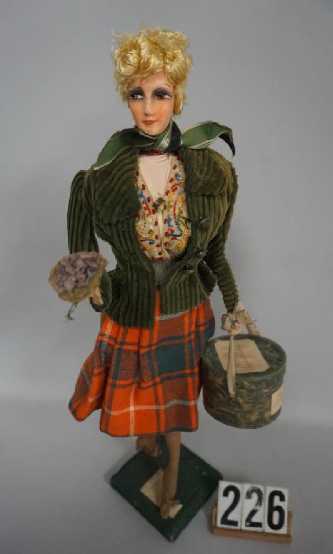 18 INCH CLOTH MASK FACE FRENCH DOLL, MADE IN FRANCE: 18 INCH CLOTH MASK FACE FRENCH DOLL, MADE IN FRANCE LABEL ON LEFT SHOULDER, CLOTH BODY, WELL DRESSED HOLDING A HAT BOX IN HER LEFT HAND, POUPEE FABRETTE, HAS WORN OUT AREA OF FABRIC ON HER LEFT CHEEK