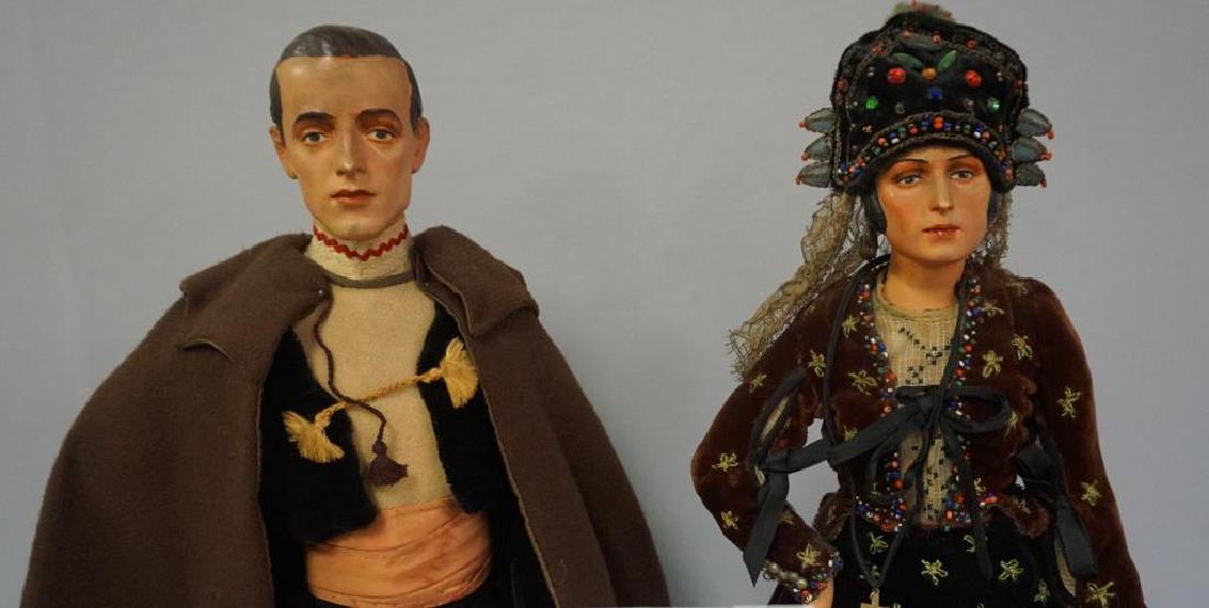 PAIR OF 16 INCH ALL PLASTER MOLDED DOLLS WITH NICELY: PAIR OF 16 INCH ALL PLASTER MOLDED DOLLS WITH NICELY MODELED FACES / HEADS WITH DETAILED FEATURES, HAIR & EARS, EACH ARE DRESSED IN ORIGINAL PERIOD OUTFITS & EACH ARE ATTACHED TO A WOODEN BASE WITH AT