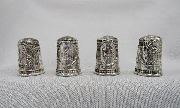 4 STERLING SILVER COMMEMORATIVE STATEHOLD THIMBLES: CONNECTICUT, DELAWARE, GEORGIA & NEW YORK. 4 STERLING SILVER LINED WITH 24 KARAT GOLD FROM THE FRANKLIN MINT