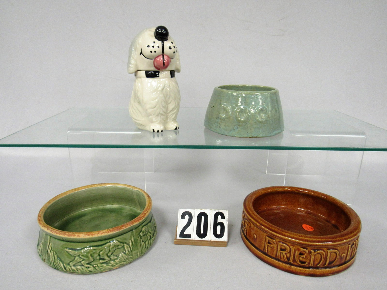 4 PC. McCOY POTTERY LOT:: LOT INCLUDES 3 DIFFERENT DOG FEEDING DISHES PLUS DAN THE DOG SNACK JAR. AVERAGE WEAR TO VG