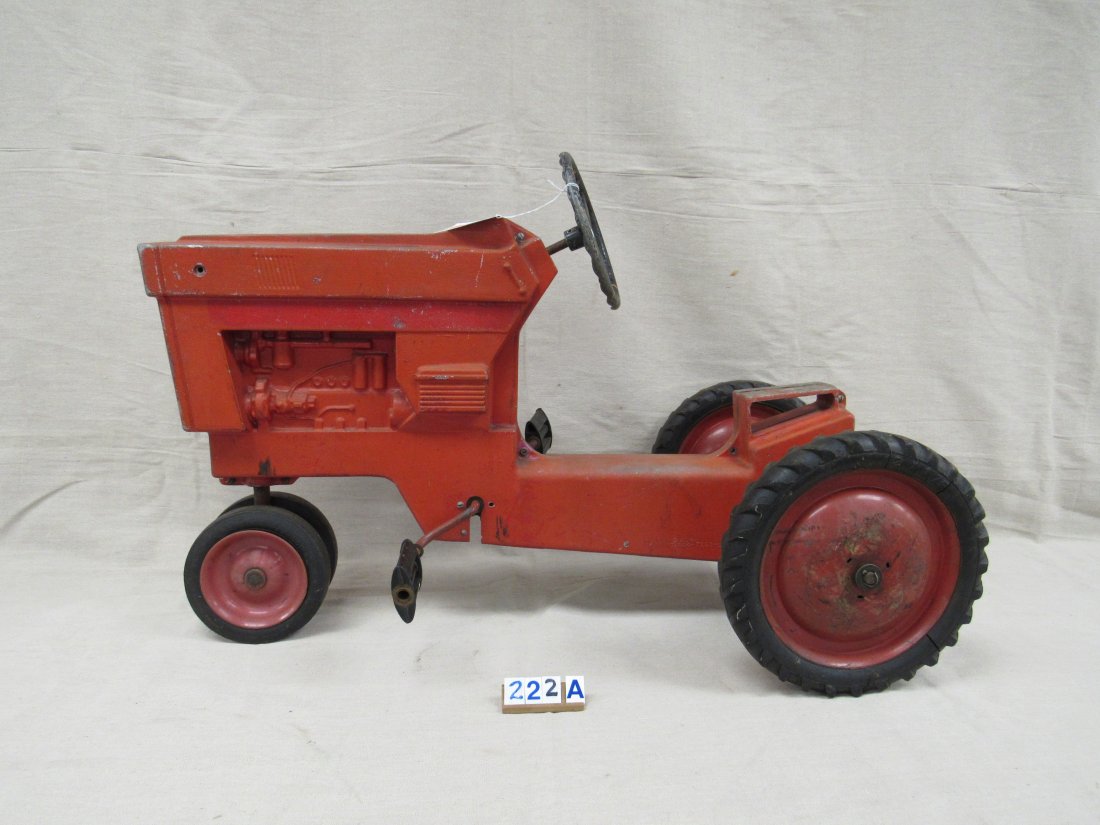ERTL PEDAL FARM TRACTOR:: MODEL #404. CAST ALUMINUM FRAME. SEVERAL MISSING PIECES. PAINT WEAR & RUST. 36 IN. L, 24 IN. H - FAIR