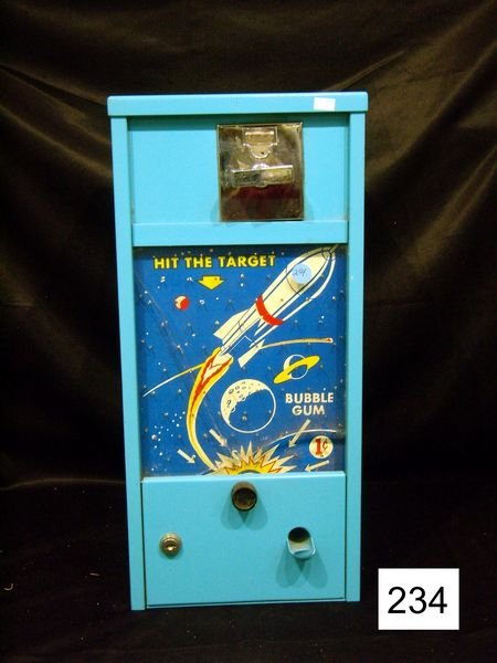 "Hit The Target" One Cent Bubble Gum Machine W/Spa: "Hit The Target" One Cent Bubble Gum Machine W/Spaceship & Outerspace Scene On Front - Front Glass Is Broken - Pcs. Missing, No Key, Mfgr. Unknown, 19 1/2"H, 9 1/2"W, 10"D Incldg. Gumball Shoot - Good
