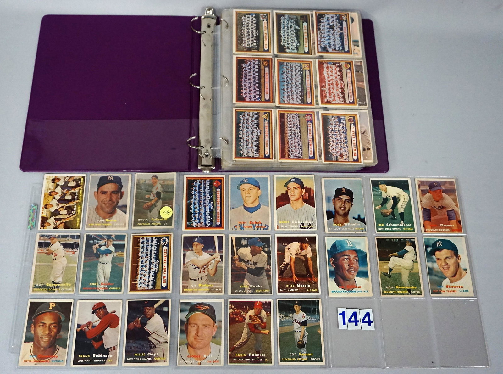 (249 DIFFERENT) 1957 TOPPS BASEBALL CARDS IN ALBUM: INCLUDING BERRA, CLEMENTE, MAYS, F. ROBINSON (R) CAMPY, ETC., AVERAGE VG/EX TO EX, SOME BETTER, SOME LESSER