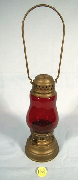 ANTIQUE SKATERS LANTERN W/ DARK RED COLORED GLASS