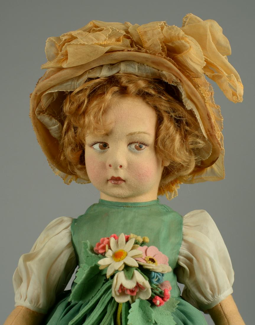 FANCY LENCI ALL FELT GIRL 17 1/2 IN.: ITALY, CIRCA 1925, ALL FELT DOLL WITH BROWN PAINTED SIDE GLANCING EYES, PAINTED FACIAL FEATURES, ORIGINAL BLONDE MOHAIR WIG, ORIGINAL GREEN ORGANDY FANCY OUTFIT WITH APPLIED FELT FLOWERS, IVORY ORGAND