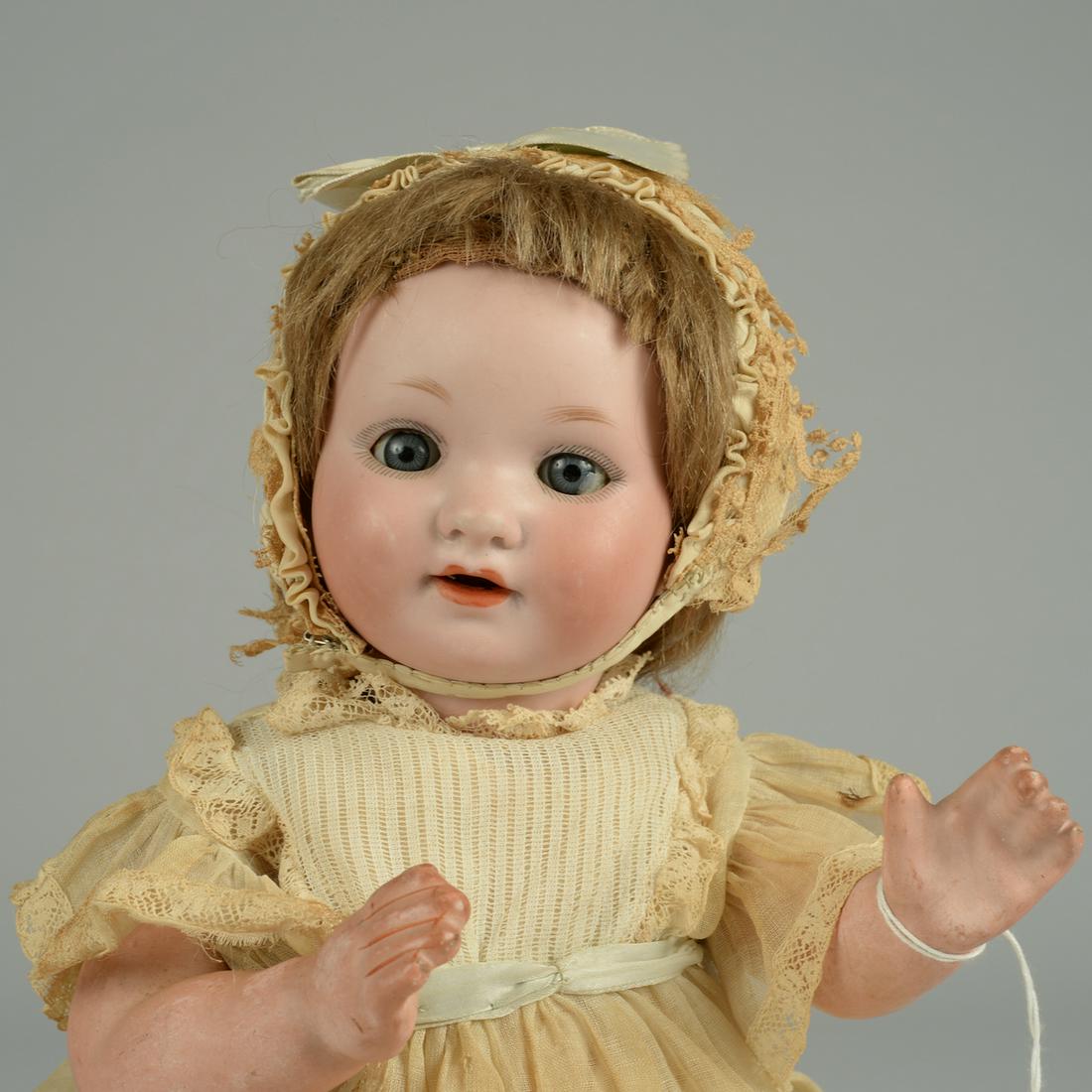 ARMAND MARSEILLE 985 BABY 12 IN.: GERMANY, CIRCA 1910, BISQUE SOCKET HEAD INCISED GERMANY A 985 M 0, BLUE SLEEP EYES, OPEN MOUTH WITH TWO PORCELAIN UPPER TEETH, BROWN MOHAIR WIG, FIVE PIECE COMPOSITION BABY BODY WHITE BABY DRESS AND M
