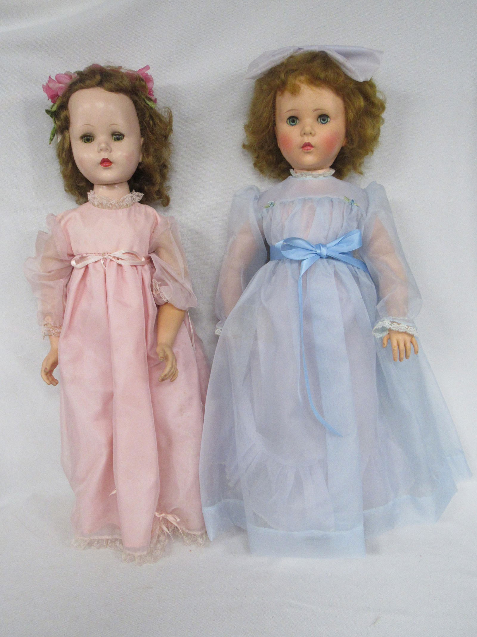 (2) LARGE AMERICAN CHARACTER SWEET SUES:: 30 IN. VINYL & ARMS - HARD PLASTIC BODY & LEGS, WALKING MECHANISM WORKS FINE, JOINTED ELBOWS & KNEES, BOX INTACT BUT HAS WATER STAINS. 30 IN. HARD PLASTIC HEAD, BODY, ARMS & LEGS - VINYL JOINTED ARMS