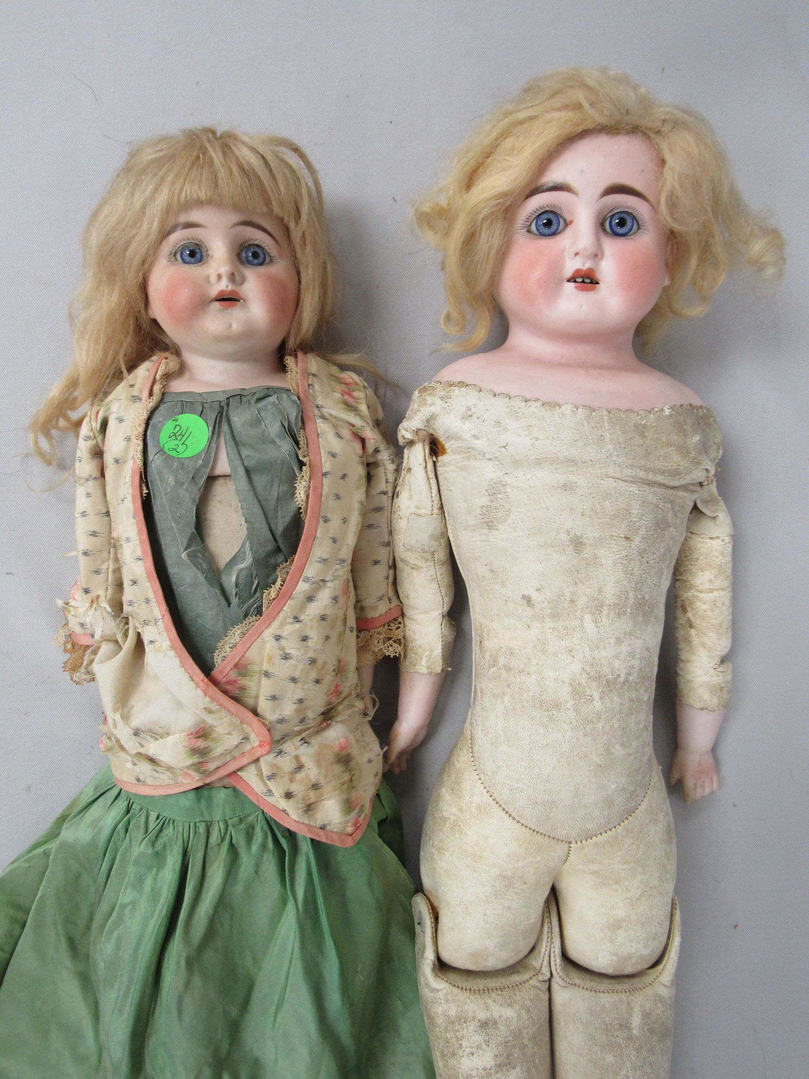 BISQUE DOME HEAD SHOULDER PLATE:: FIXED EYES. KID BODY - BISQUE ARMS - CLOTH LOWER LEGS, EXTRA HIP JOINTS. UNDER ARM & KNEE REPAIRS. 23 IN. - SHOULDERPLATE, FIXED EYES, BISQUE LOWER ARMS, LEFT HAND MISSING THUMB, BODY STAINED - FAIR T