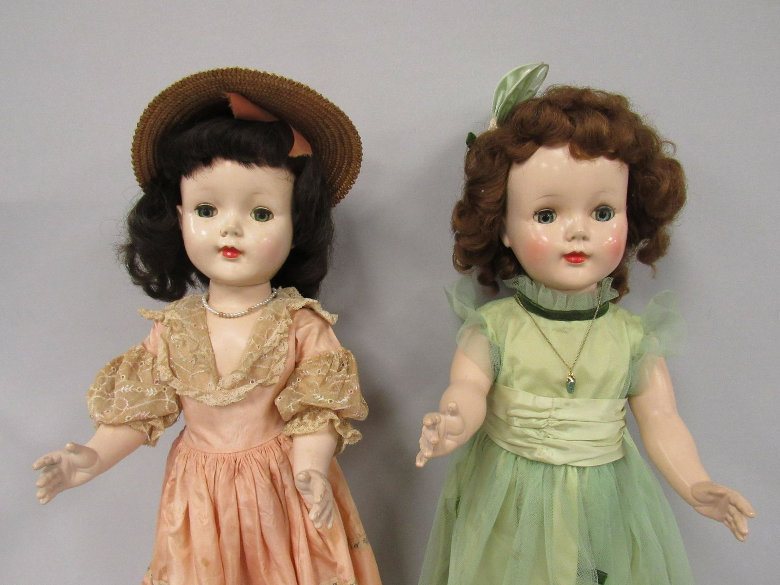 2 AMERICAN CHARACTER "SWEET SUES":: 24 IN. HP BRUNETTE ALL ORIGINAL, NEEDS CLEANING, SMOOTH WALKER. 24 IN. HP RED HAIR, GOOD FACIAL COLOR, GOWN REPLACED, WALKS WELL - FAIR/GOOD