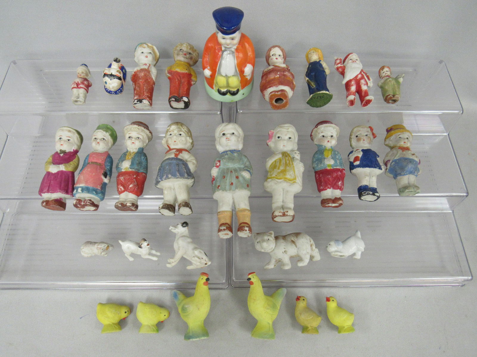 29 ALL BISQUE SMALL FIGURINES:: PLAY DIRT - SOME HAVE CHIPS ON TOES OR LEGS - MADE IN JAPAN OR GERMANY 2 IN. - 4 IN. - 1 CHARACTER IS A BELL, 1 IS AN ELF, 2 CHICKENS, 4 CHICKS, 4 DOGS 1 WITH BROKEN LEG. NONE ARE JOINTED