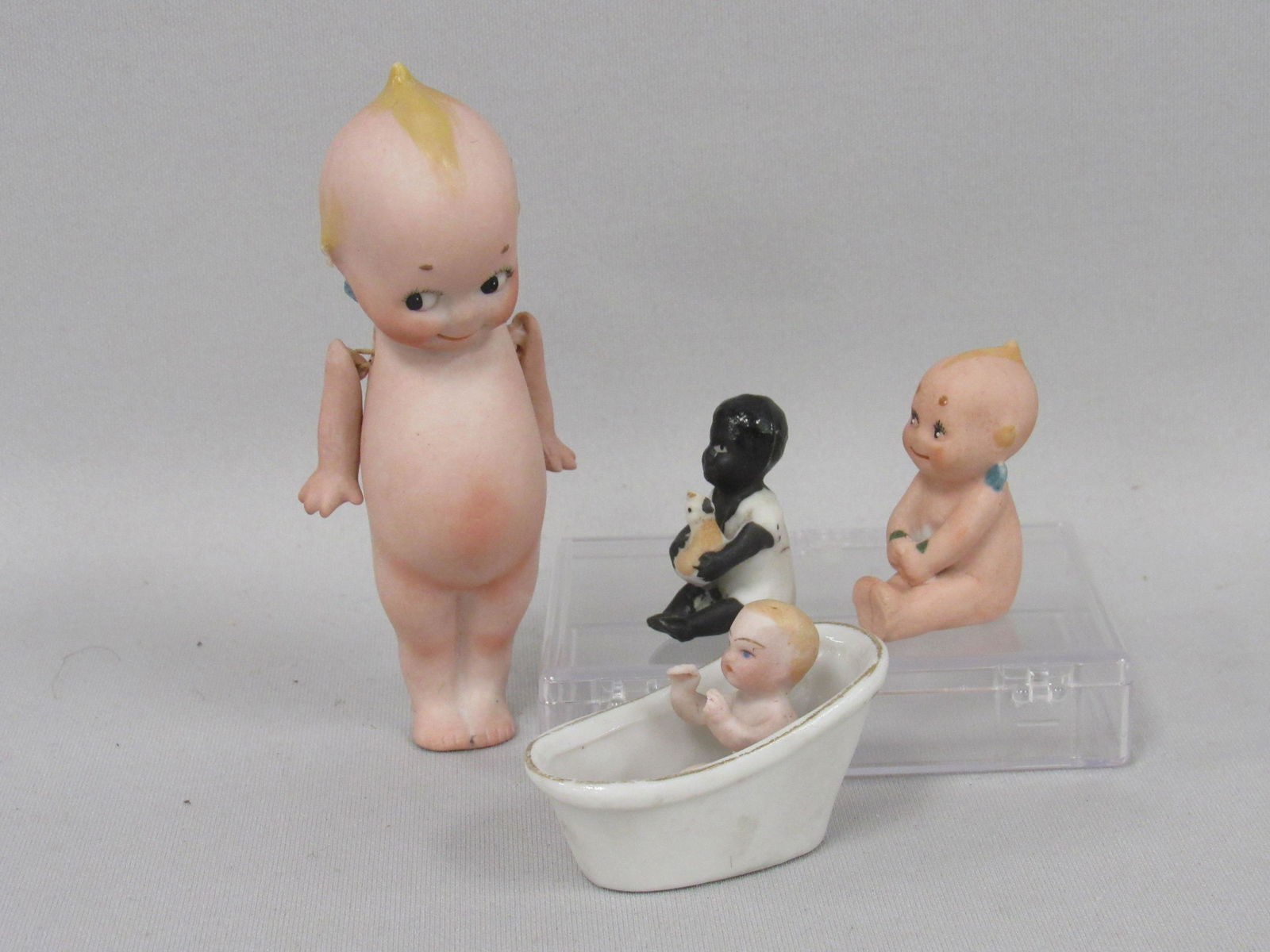 KEWPIES & TWO SMALL BISQUE BABIES: (1 of 8)