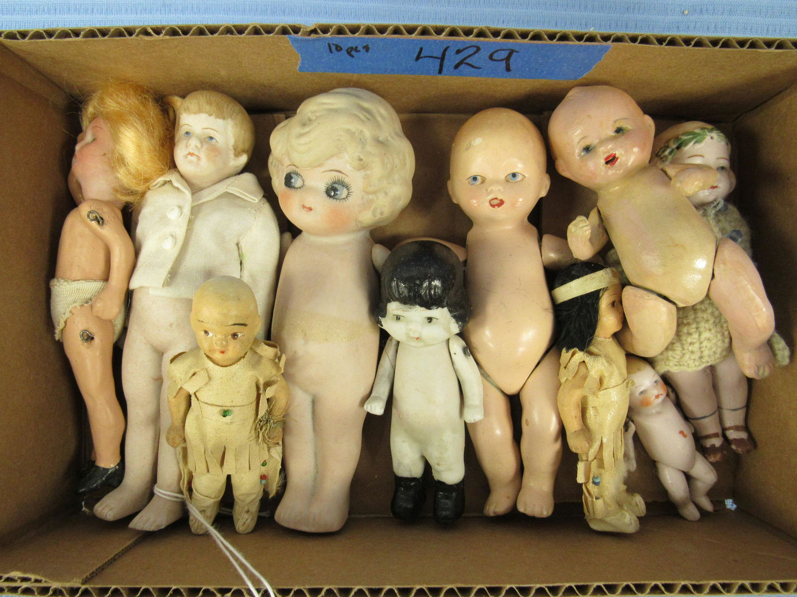 LOT OF 10 ALL BISQUE DOLLS:: MARKED GERMANY, 5 1/2 IN. BISQUE HEAD PAINTED BISQUE BODY "WALTHIER & CO." - PAINTED BISQUE BABY HOLDING BOTTLE. 5 1/2 IN. SCUFFS ON FOREHEAD. PAINTED BISQUE BABY 2 1/2 IN. 5 1/2 IN. GIRL PAINTED FLOW