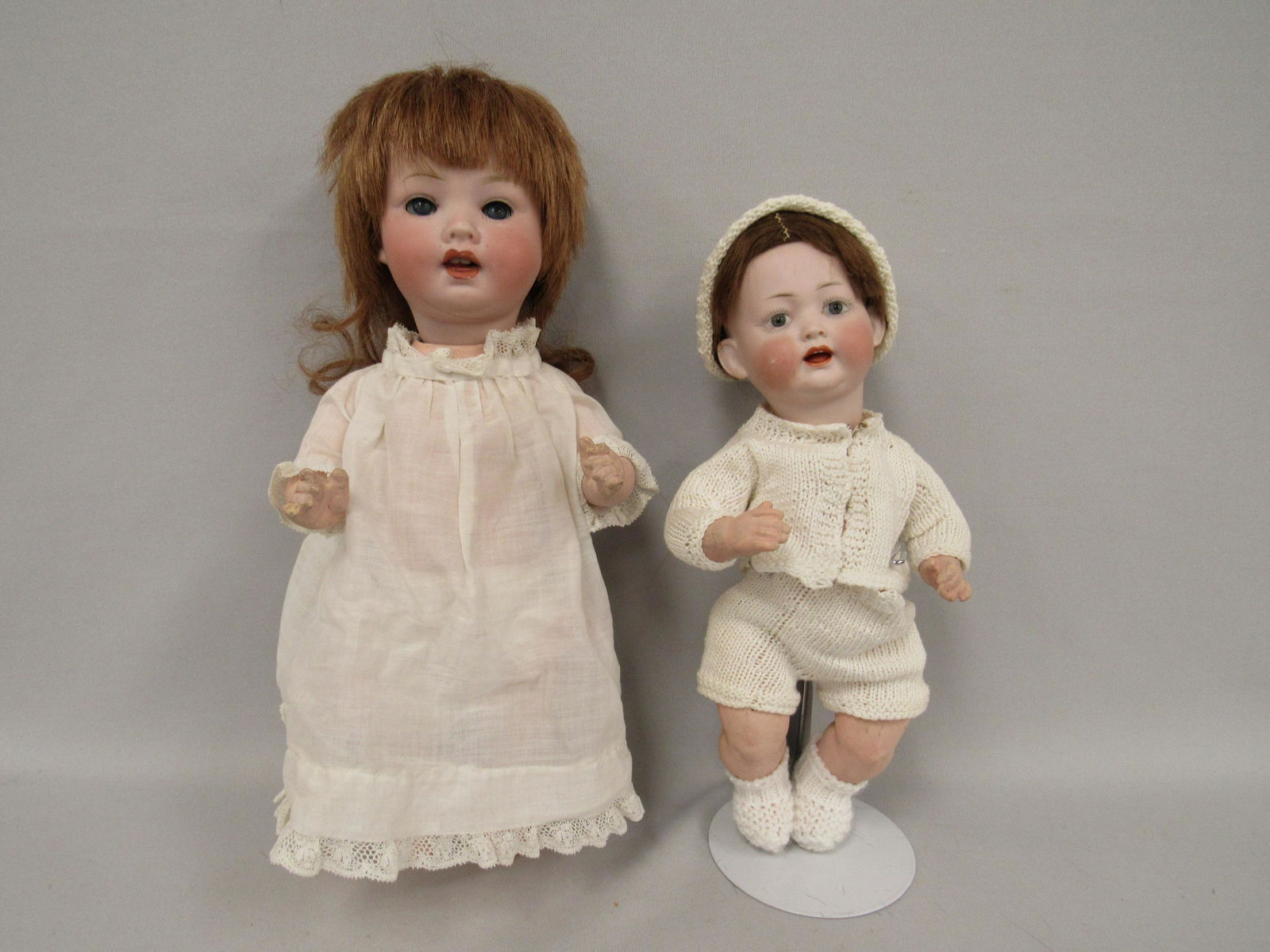 2 BISQUE HEAD BABIES:: 11 IN. KLEY & HAHN MARKED 167 SET EYES, OPEN MOUTH WITH TONGUE, SCUFF ON RIGHT CHEEK. 5 PIECE BABY BODY WITH NORMAL WEAR. 13 IN. BISQUE HEAD MARKED PM 914, PORZELLAN FABRIK MENGERSGERUTH. TODDLER BODY