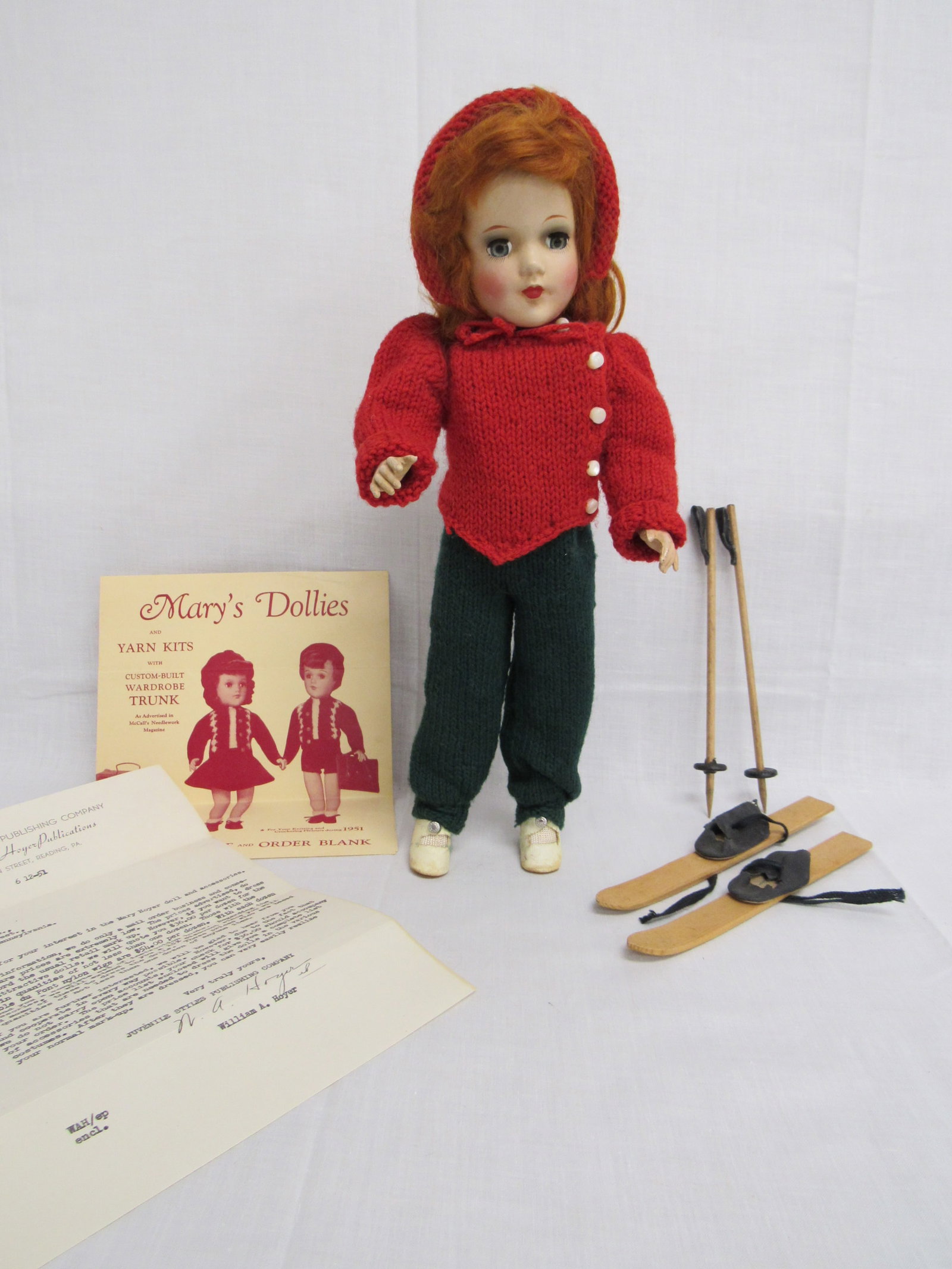 14 IN. H.P. MARY HOYER IN SKI OUTFIT:: COMPLETE WITH SKIS & POLES. ALSO INCLUDES COMPANY PRICE LIST & LETTER. MARKED ON BACK, ORIGINAL MARY HOYER - VG