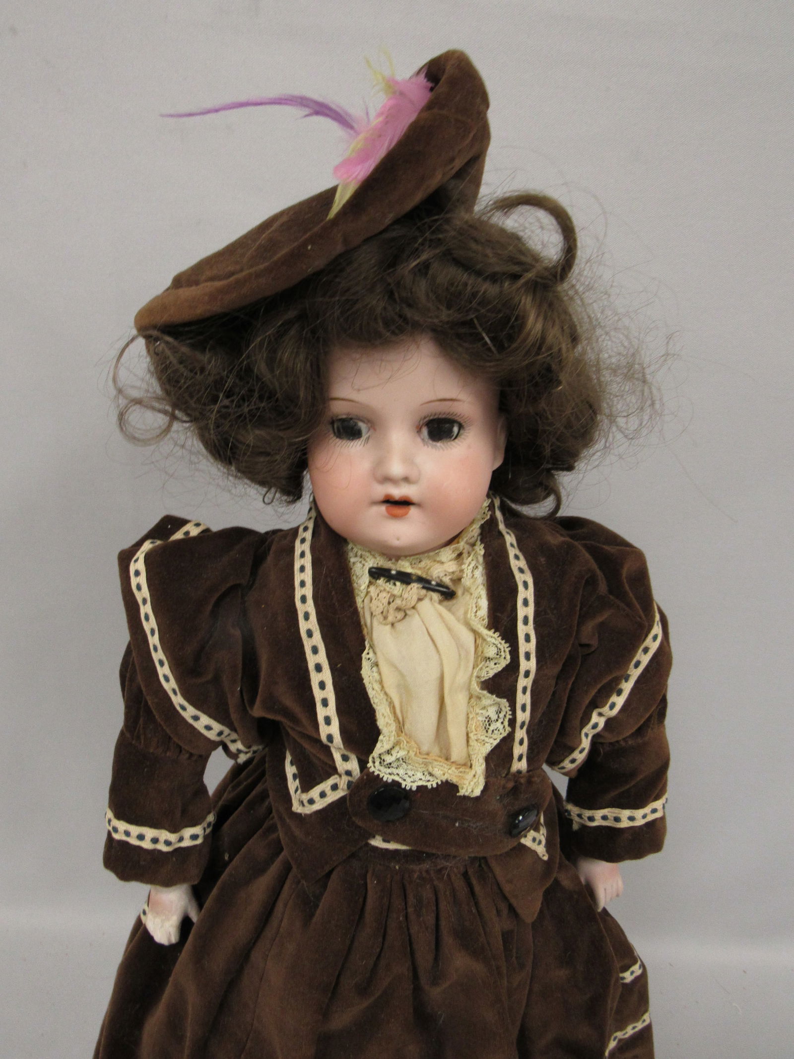 20 IN. AM 370 MARKED ARMAND MARSEILLE GERMANY 370:: BISQUE SHOULDERHEAD EYES TAPED IN. KID BODY WITH RIVIES JOINTED AT SHOULDER, ELBOWS, HIPS & KNEES. BISQUE LOWER ARMS (RT REPAIRED) COMPO LEGS - FAIR-GOOD
