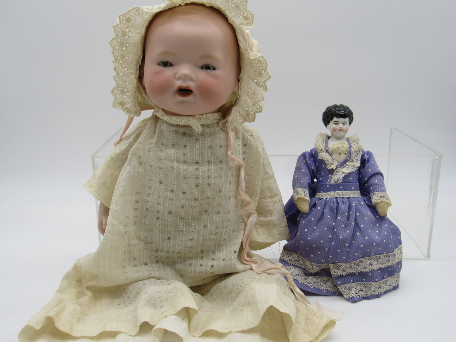13 IN. DREAM BABY, 8 IN. CHINA HEAD DOLL:: BABY HAS SOLID DOME HEAD WITH NO VISIBLE DAMAGE, EYES DO NOT SLEEP & TEETH HAVE FALLEN BACK INTO HEAD. CLOTH BODY WITH REPLACED ARMS. DOLL'S CHINA HEAD HAS BEEN REPAIRED, REPLACED BODY - FAIR-GOOD