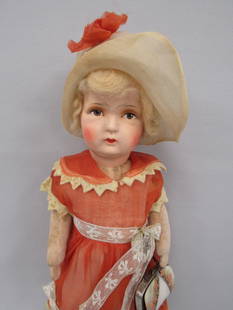 15 IN. COMPOSITION & CLOTH DOLL:: COMPO HEAD CLEAN, CHEEK SCUFF ON RIGHT SIDE. CLOTH STUFFED BODY WITH JOINTED ARMS & LEGS. THERE IS A STAIN ON BOTH LEGS. ORIGINAL DRESS & HAT WITH FELT TRIM. SHE HAS A MOTHER OF PEARL PURSE