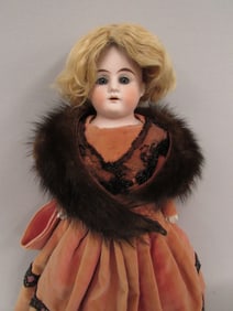 16 IN. BISQUE SHOULDER PLATE WITH CLOTH BODY: