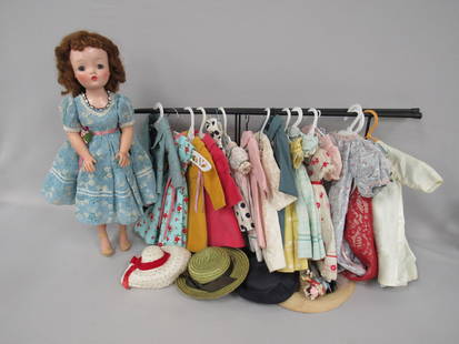 21 IN. MME. ALEXANDER "CISSY":: CLEAN WITH NO SPLITS OR BREAKS. HER FACE LOOKS REFINISHED WITH EYELASH WORK. SHE HAS A TAGGED OPERA DRESS & COAT WITH APPROX. 24 PIECES OF PROFESSIONALLY MADE DRESSES, COATS & GOWNS. SHE ALSO HAS