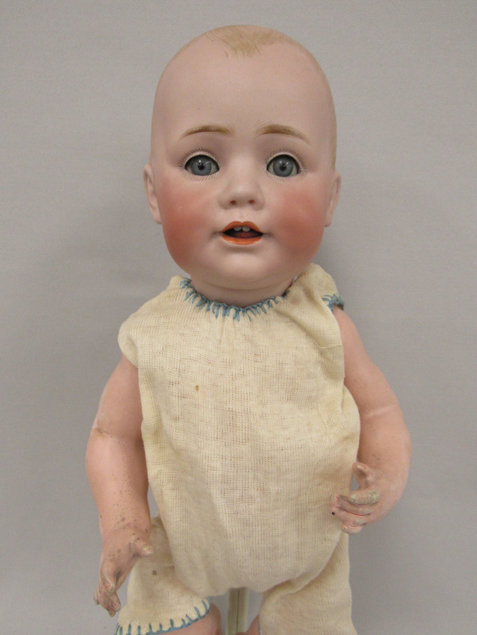 15 IN. KESTNER "BABY JEAN":: BALD BISQUE SOCKET HEAD JDK MADE IN GERMANY 12, WITH SLEEPING BLUE GLASS EYES, OPEN MOUTH WITH 2 PORCELAIN UPPER TEETH, FULL ROSY CHEEKS WITH DIMPLES, ON HER ORIGINAL FIVE-PIECE BABY BODY, WITH KNIT R