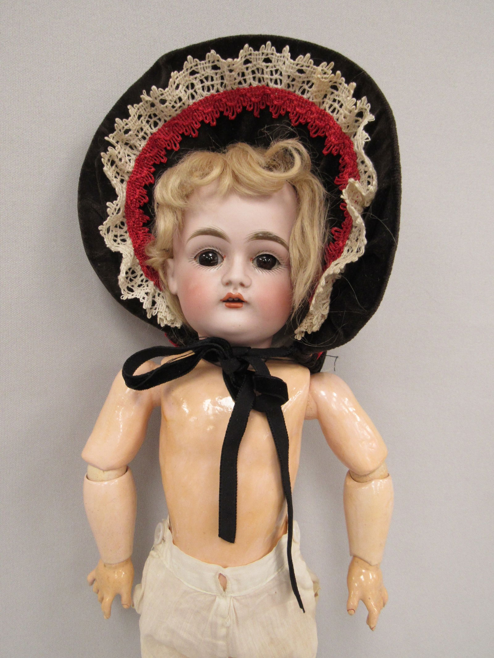 14 ½ IN. KESTNER MARKED MADE IN GERMANY 167:: BISQUE HEAD DAMAGE FREE OPEN MOUTH WITH TEETH & SLEEP EYES. COMPO BODY IS VERY CLEAN. IT IS STAMPED GERMANY 01/2. SHE HAS ORIGINAL WIG & PLASTER PATE. NICELY DRESSED