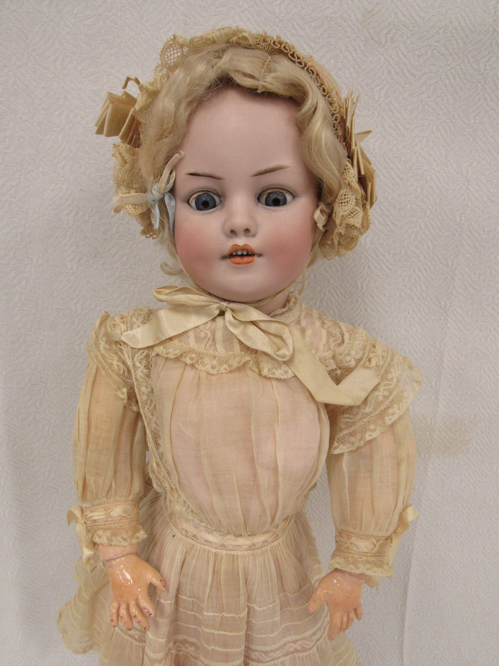 21 IN. SIMON & HALBIG DIMPLED CHARACTER CHILD:: BISQUE SOCKET HEAD INCISED S & H 1279 DEP 11, BLUE GLASS EYES (DO NOT FULLY SLEEP) FLY-AWAY EYEBROWS, UPTURNED NOSE, OPEN MOUTH WITH 4 MOLDED TEETH, DIMPLED CHEEKS, PIERCED EARS, ORIGINAL FULLY JOINTE