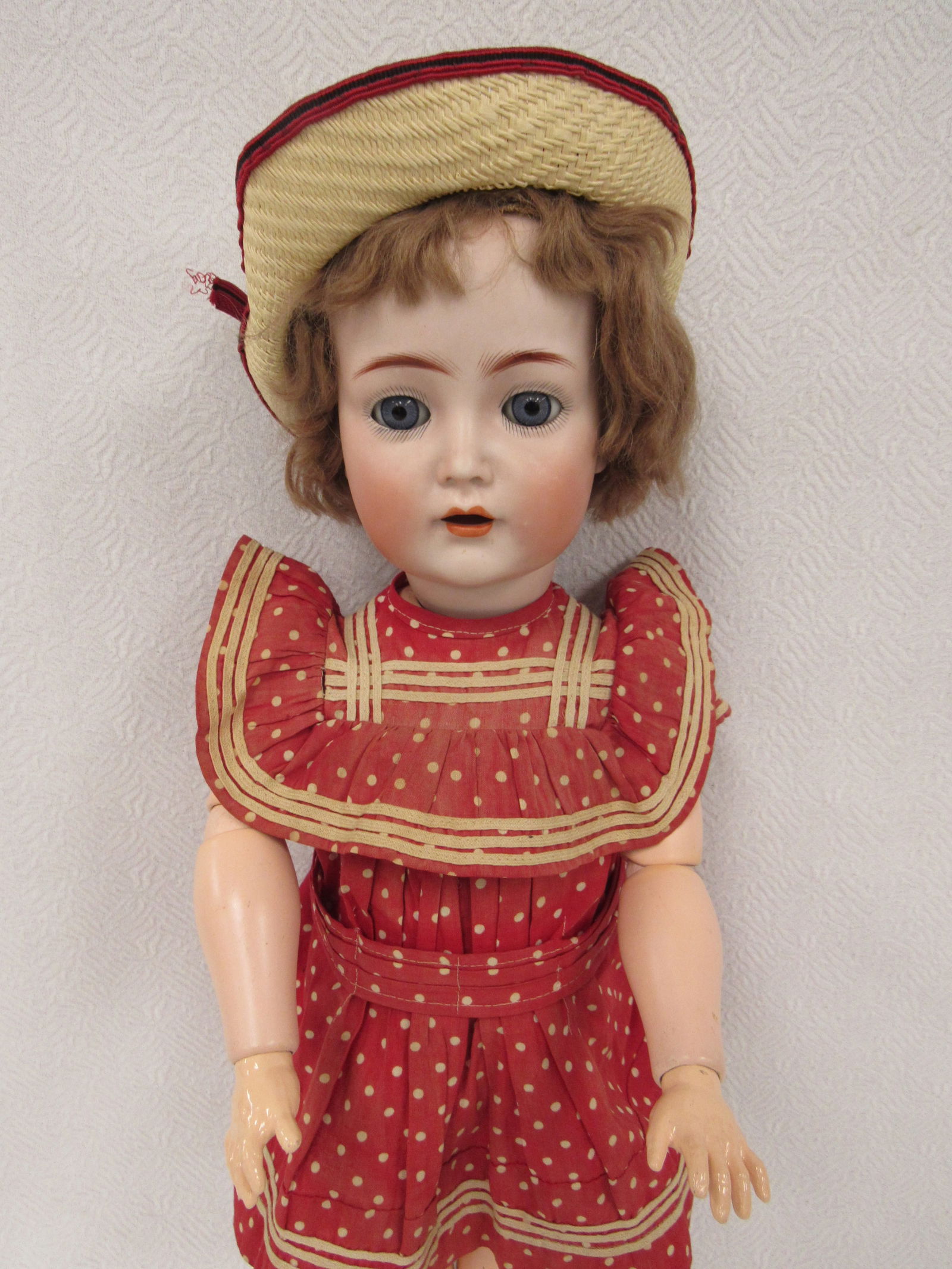 KAMMERER & REINHARDT 117N CHARACTER FLAPPER DOLL:: 20 IN. BISQUE SOCKET HEAD INCISED K (STAR) R SIMON HALBIG 117N GERMANY, BLUE GLASS SLEEPING EYES, TINY UPTURNED NOSE OPEN MOUTH WITH FOUR PORCELAIN TEETH, ON HER ORIGINAL FLAPPER BODY WITH SIDE-JOINTE