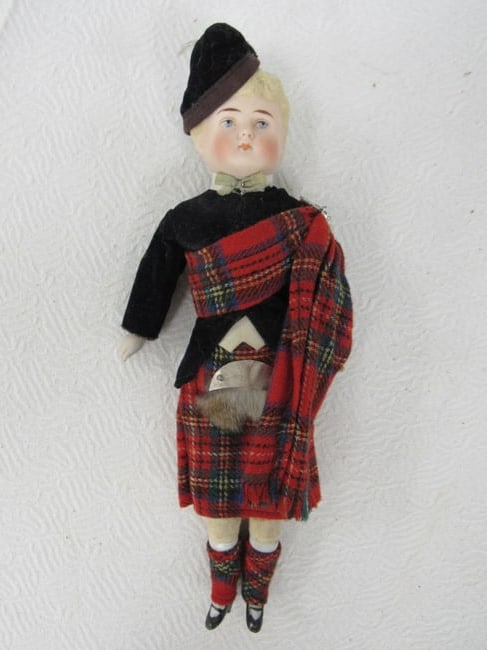10 IN. ORIGINAL OUTFIT NOT REMOVED:: PARIAN SHOULDER PLATE SCOTTISH BOY WITH BISQUE ARMS & LOWER LEGS