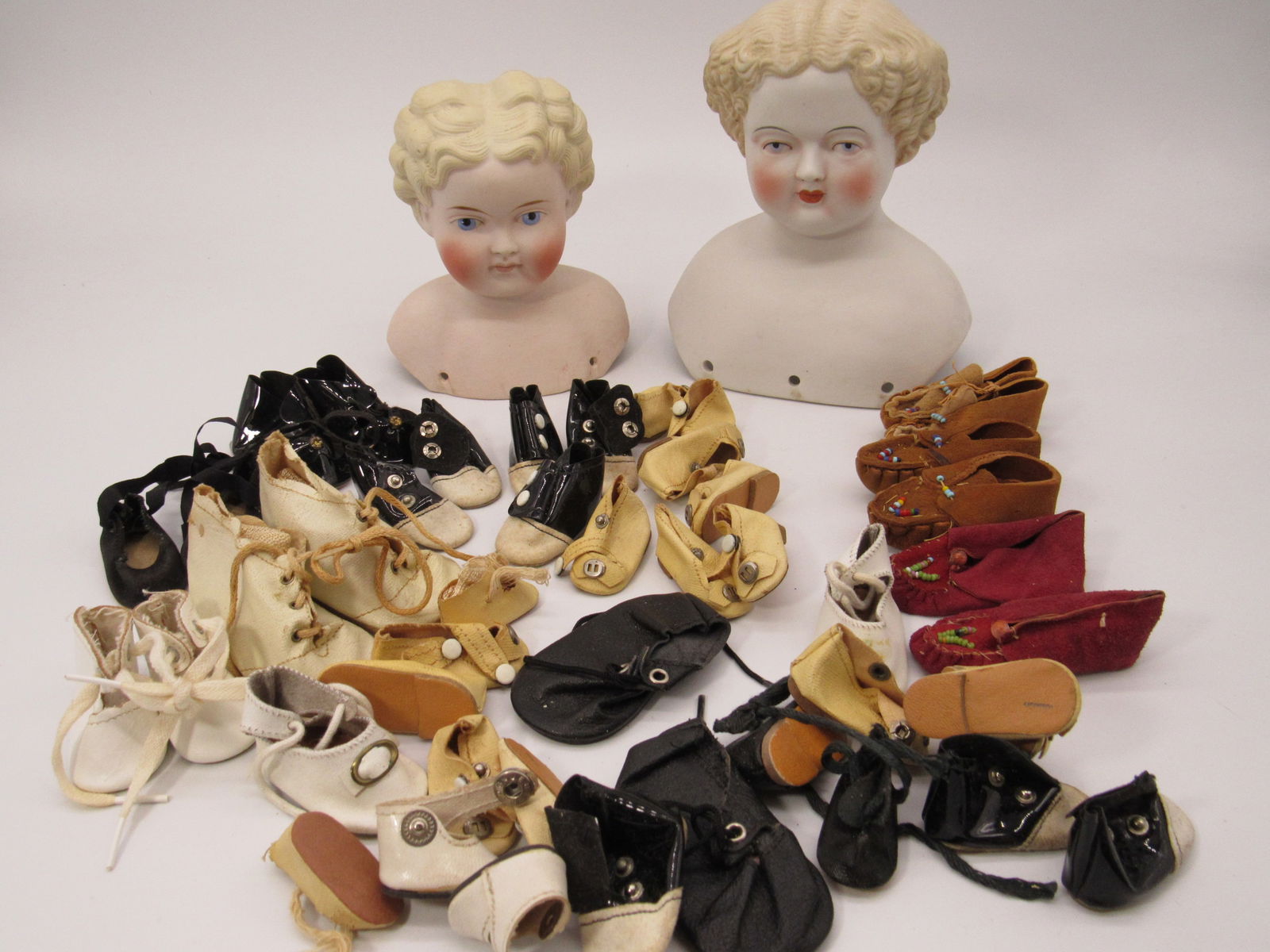 2 PARIAN HEADS & BAG OF DOLL SHOES: (1 of 8)