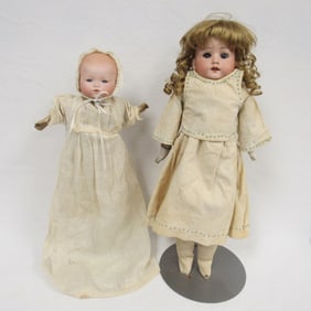 PAIR OF BISQUE HEAD DOLLS: