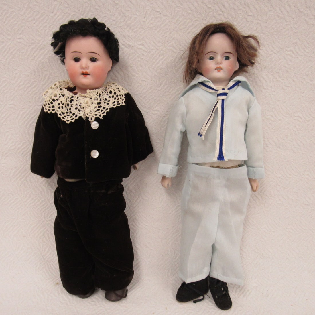 PAIR OF BISQUE SHOULDER PLATE BOYS:: 12 IN. LIGHT BLUE SAILOR SUIT MARKED P 607/4 GERMANY, BISQUE SHOULDER PLATE CLOTH BODY REPLACED ARMS, RIVET JOINTS AT HIPS, 12 IN. SCHOENAU & HOFFMEISTER MARKED S STAR H, BISQUE SHOULDER HEAD (NO DAMA