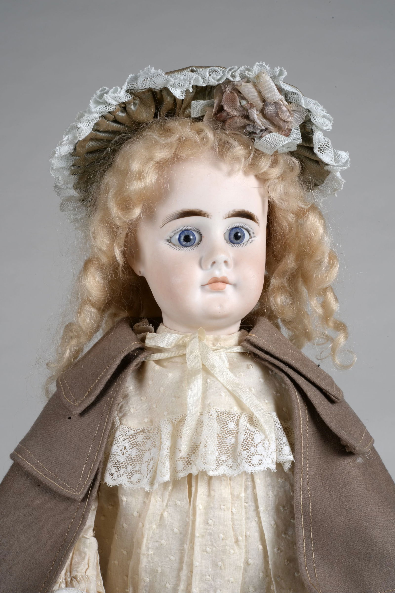 19 IN. SONNEBERG "S & H 949 LOOK-A LIKE":: SOLID DOME BISQUE SOCKET HEAD (PERFECT BISQUE) INCISED 630 OVER 9, LARGE BLUE GERMAN PAPERWEIGHT EYES, UPTURNED NOSE, FULL BLUSHED CHEEKS, CLOSED POUTY MOUTH, DIMPLED CHIN, PIERCED EARS, JOINTED WOOD