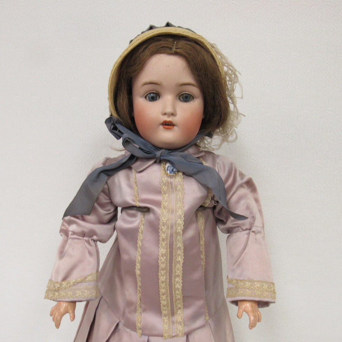 22 IN. KESTNER MARKED E 1/2 MADE IN GERMANY:: 9 1/2 168, ON NECK MADE IN GERMANY 08. BISQUE SOCKET HEAD - DAMAGE FREE, SLEEP EYES, OPEN MOUTH WITH TEETH. COMPO BODY CLEAN WITH CHIPS ON LEFT ELBOW, CROTCH & CRACK ON RIGHT LOWER ARM