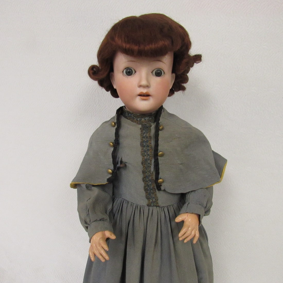 23 IN. MARKED GERMANY 6:: BISQUE SOCKETHEAD DAMAGE FREE SLEEP EYES, OPEN MOUTH WITH TEETH. CLEAN COMPO BODY WITH NORMAL WEAR. OLD TAPE ACROSS CHEST & BACK, OLD DRESS IS DECOMPOSING - G