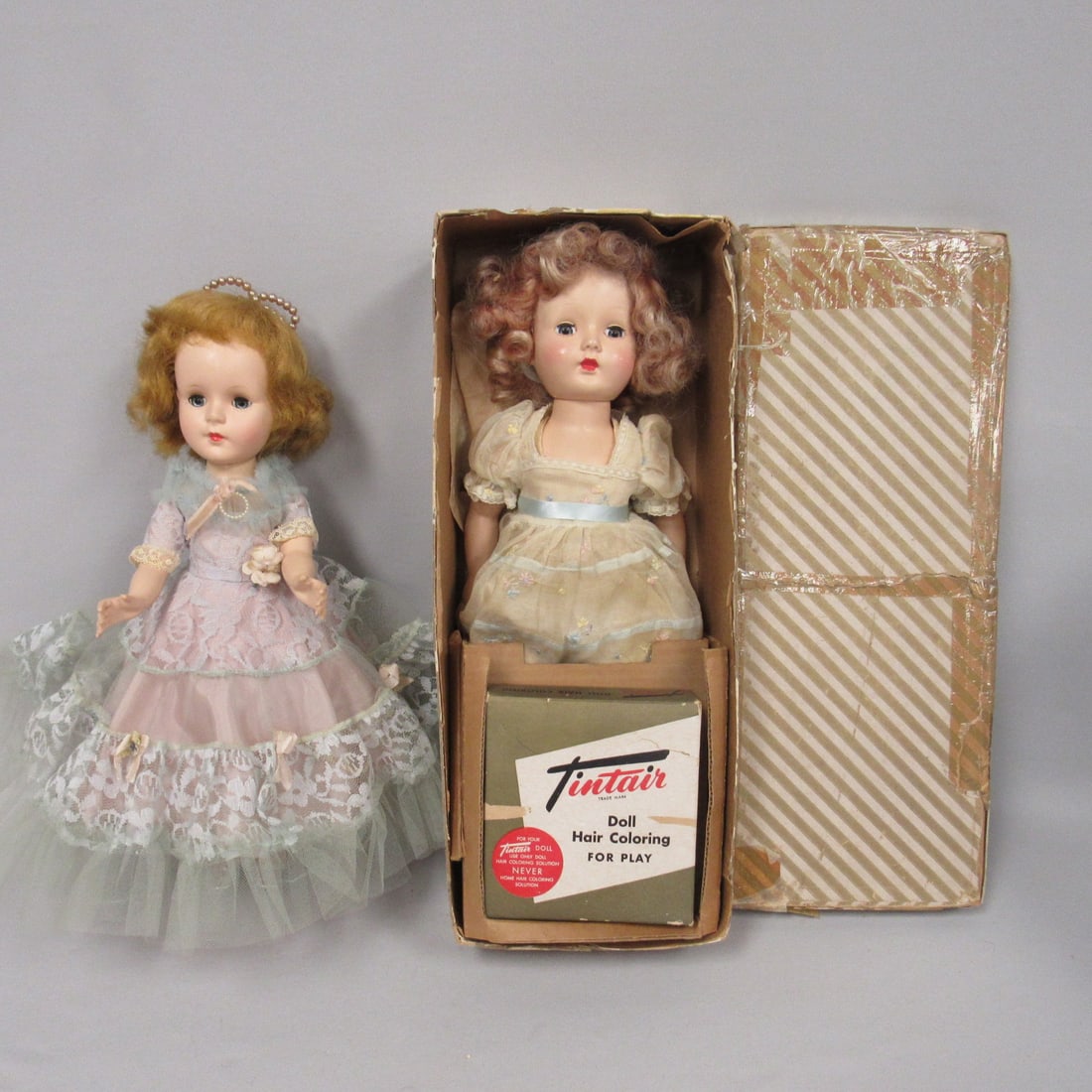 PAIR OF HARD PLASTIC DOLLS FROM THE 50'S:: 15 IN. AMERICAN CHARACTER "SWEET SUE", ALL ORIGINAL, ONE SNAP ON LEFT SHOE IS BROKEN, WALKER WORKS WELL, HAIR FLATTENED FROM STORAGE. 16 IN. EFFANBEE TINTAIR HAIR COLOR, ALL ORIGINAL WITH TAG, CURLERS