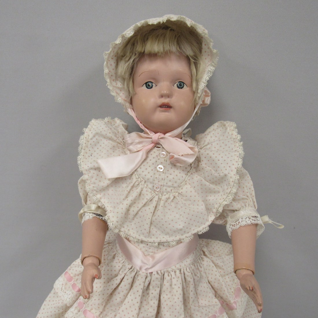 22 IN. SCHOENHUT GIRL:: ORIGINAL WIG (HAS BEEN CUT) EYE DECALS HAVE CHIPS, BODY IS CLEAN, VARNISH MARKS AT HIP JOINTS, ALL JOINTS ARE TIGHT & HOLD A POSE, ORIGINAL UNION SUIT - G, ORIGINAL SCHOENHUT LABEL