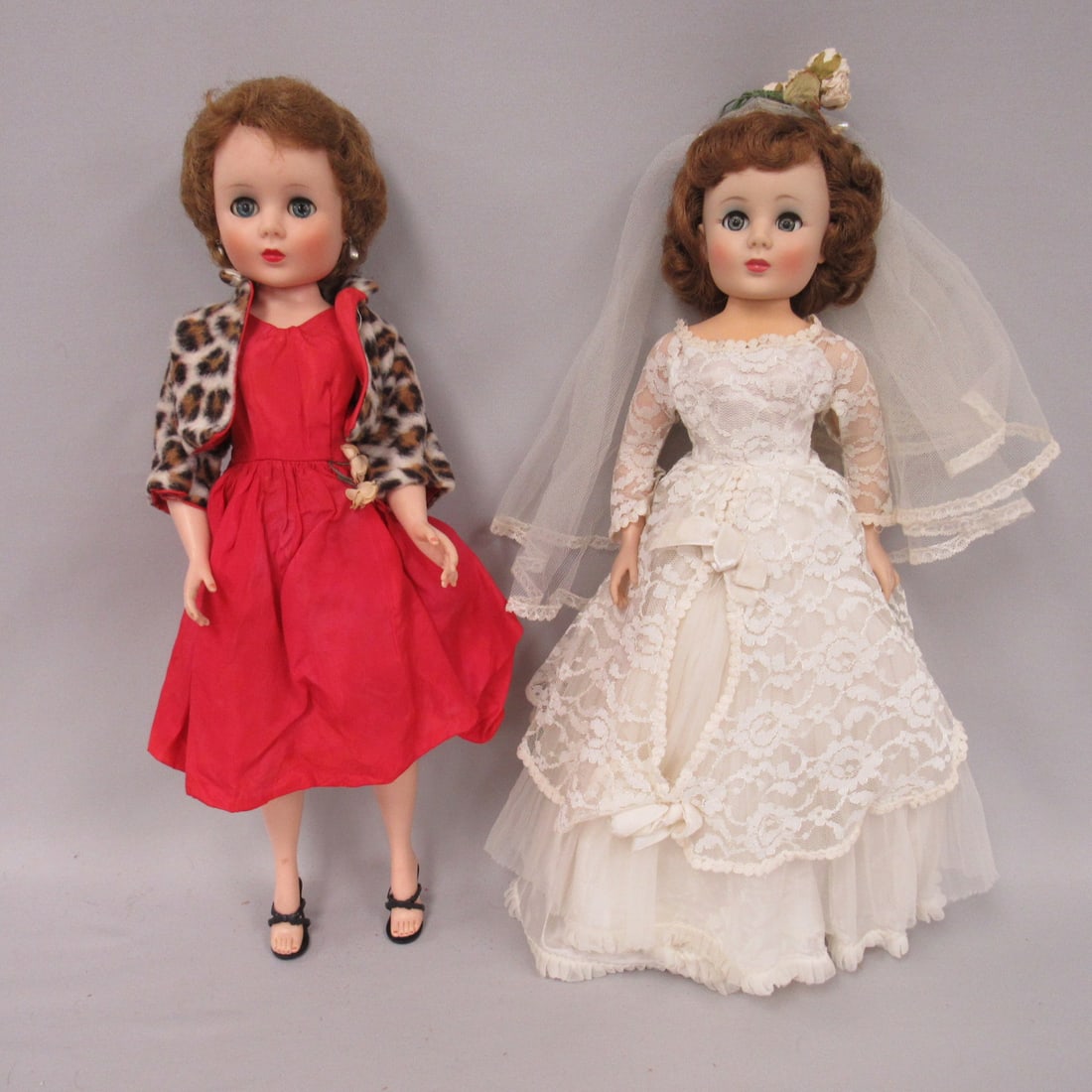 PAIR OF AMERICAN SWEET SUE SOPHISTICATES:: 19 IN. VINYL & HP, BRIDAL OUTFIT IS ALL ORIGINAL (PRICE TAG IS ON PANTIES), 2ND DOLL HAS BUBBLE HAIRCUT & ORIGINAL BUBBLE STYLE DRESS & JACKET. BRIDE HAS FLIRTY EYES