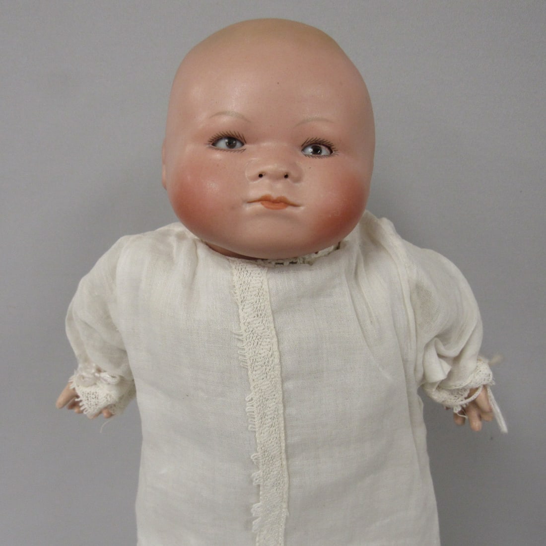 15 IN. BISQUE GERLING BABY:: MARKED 3 MADE IN GERMANY ON HEAD. 1912-1930'S. BISQUE DOME HEAD, SLEEP EYES, CLOSED MOUTH, CLOTH BODY, COMPOSITION HANDS. H.T.F. OPEN NOSTRILS CALLED A BREATHER