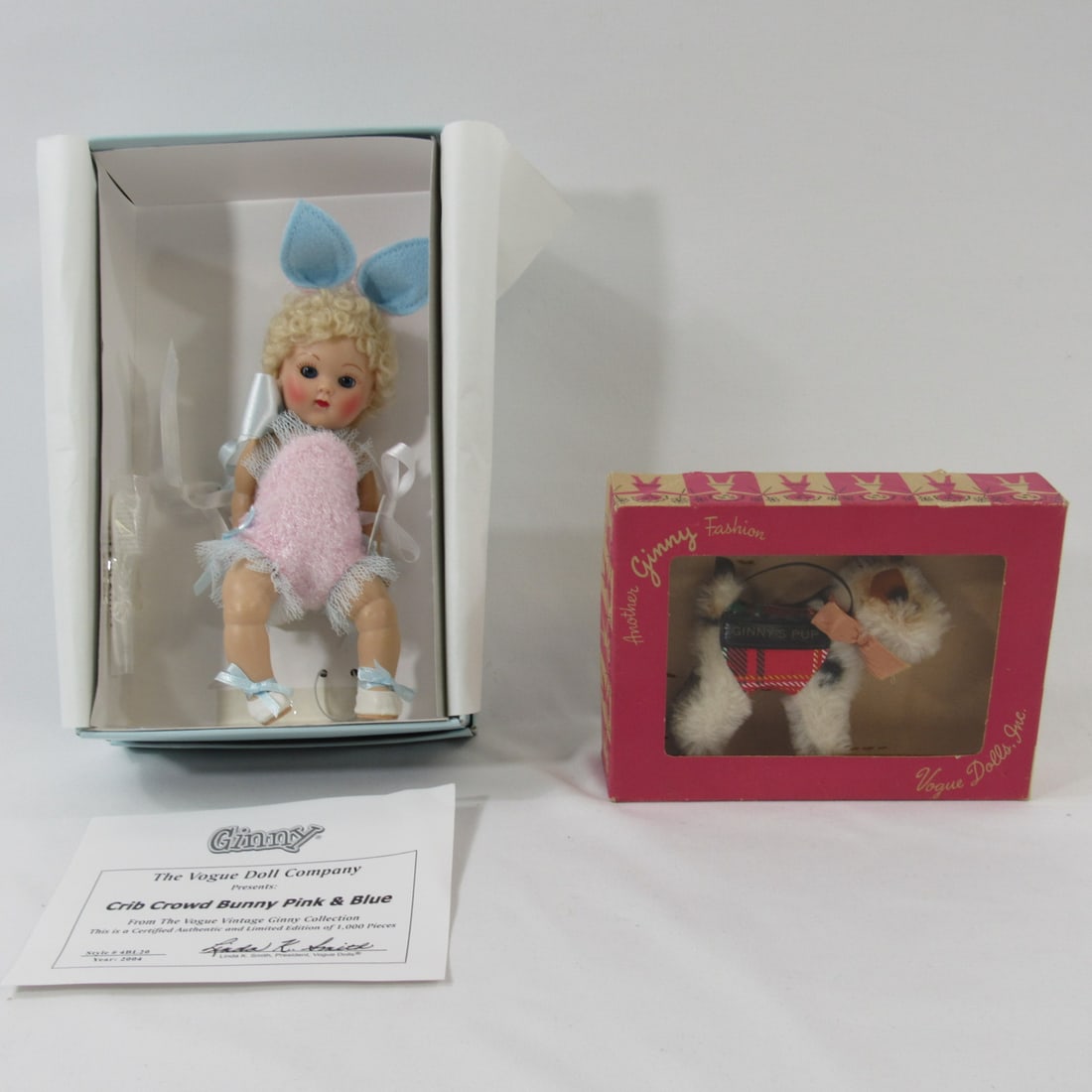 2 PCS. - VOGUE GINNY'S PUP & DOLL:: VERY SCARCE GINNY'S PUP "SPARKLES" IN ORIGINAL BOX, NEVER PLAYED WITH, DOG & BOX ARE EACH N.MT. - CIRCA 1950'S & 8 IN. CRIB CROWD BUNNY PINK & BLUE, 2004 WITH C.O.A. LIM. EDITION OF 1,000 PCS. N.MT. I