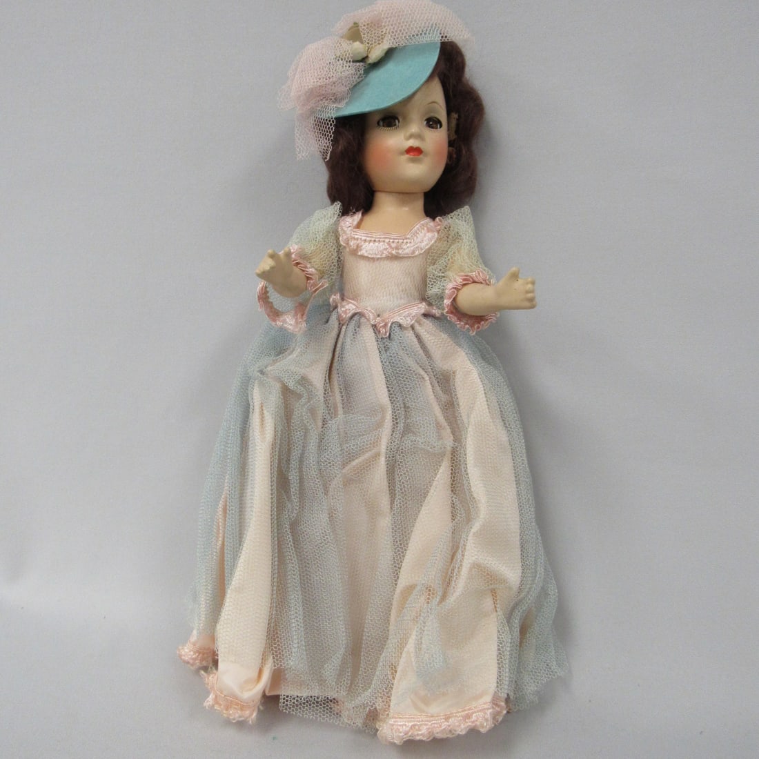 14 IN. COMPO FANCY DRESSED DOLL:: ALL ORIGINAL OUTFIT CRISPY. NOT PLAYED WITH, SHE HAS CLEAR EYES, LIGHT CRAZING, GLUE HAS DRIED & PULLING & FLAKING ON EITHER SIDE OF WIG. IT IS HIDDEN BY CURLS. DOLL IS UNMARKED