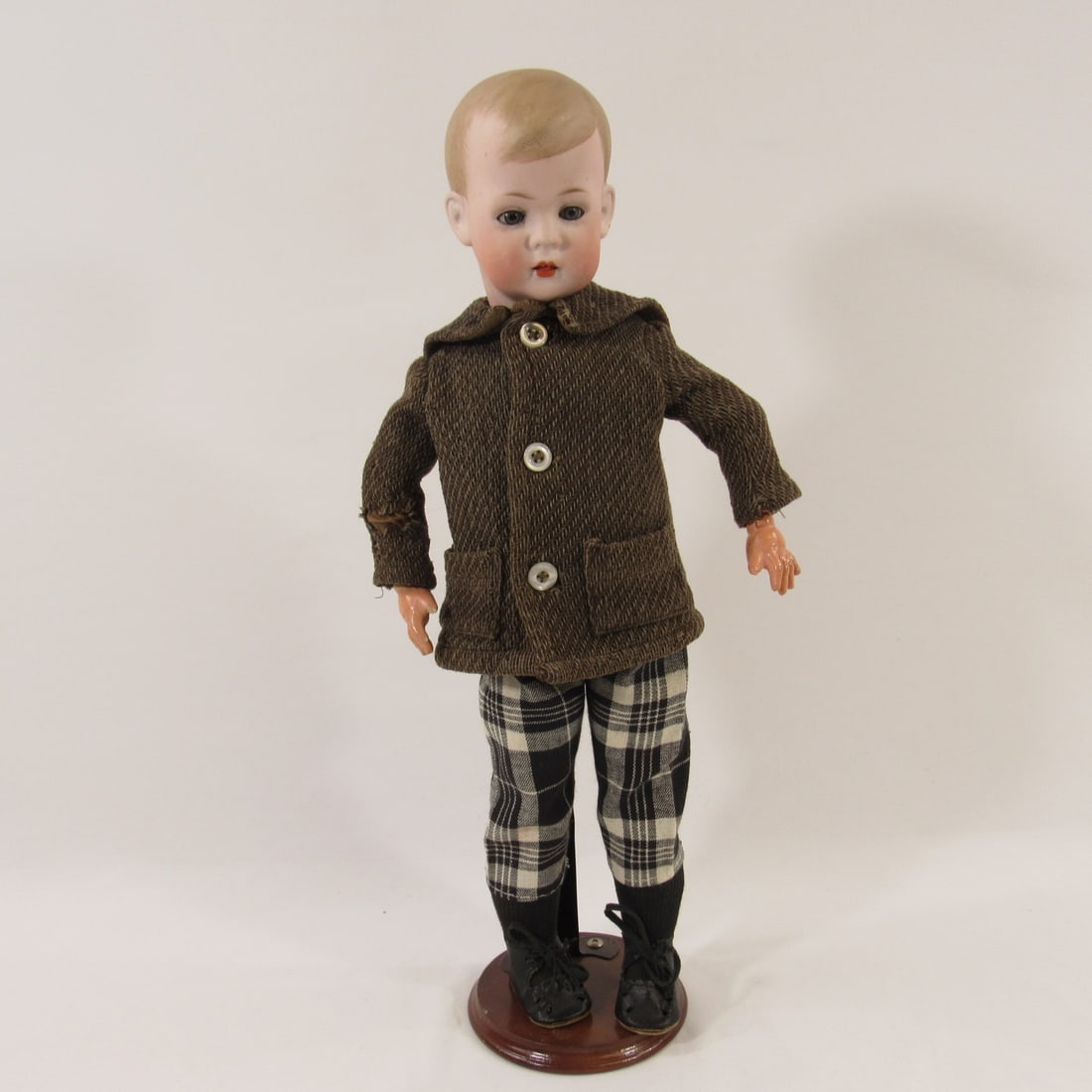 17 IN. BRUNO SCHMIDT "TOMMY TUCKER":: MOLD #2048, SOCKET HEAD WITH MOLDED & PAINTED HAIR, SLEEP EYES, B.J. COMPO BODY, RIGHT HAND WITH NICK ON INDEX FINGER & CHIP ON THUMB, SWEATER IS WORN, HOLES, ETC. NO DAMAGE OR REPAIRS TO BISQUE