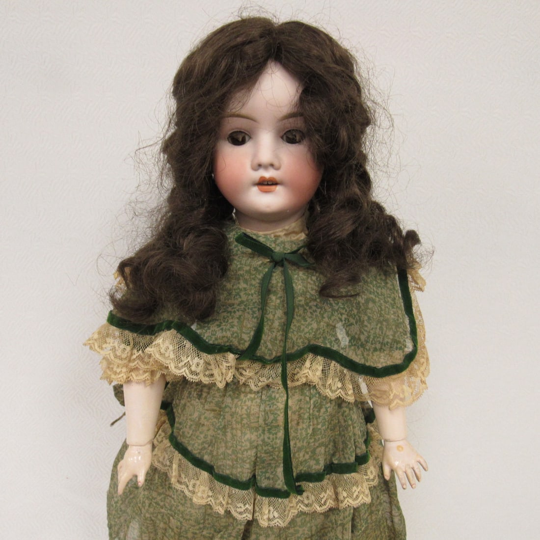 22 IN. KLEY & HAHN MARKED SPECIAL GERMANY:: BISQUE SOCKET HEAD FREE OF DAMAGE, SLEEP EYES WITH LASHES, OPEN MOUTH WITH TEETH, COMPO BODY WITH ORIGINAL FINISH, CRACKING ON RIGHT SIDE OF TORSO & TOUCH UP AT NECK SOCKET