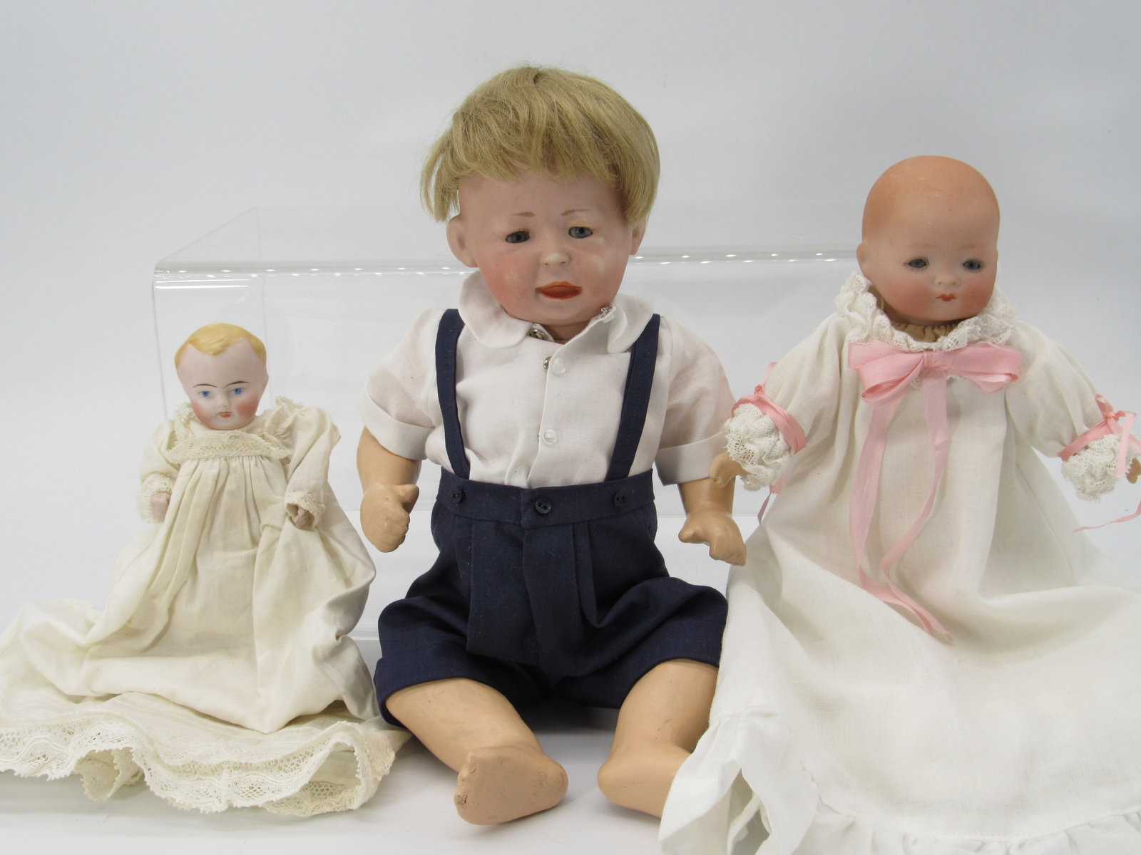 3 BISQUE HEAD BABY LOT:: INCLUDES 5 IN. ALL BISQUE BODY, POSSIBLY ORIGINAL CLOTHES, CLEAN BODY, 14 IN. 1428 SIMON HALBIG "FREDDIE" BISQUE SOCKET HEAD, SLEEP EYES, REPAIRED EYE CHIP ON LEFT EYE, SOLID COMPO BODY. 8 IN. DREAM B