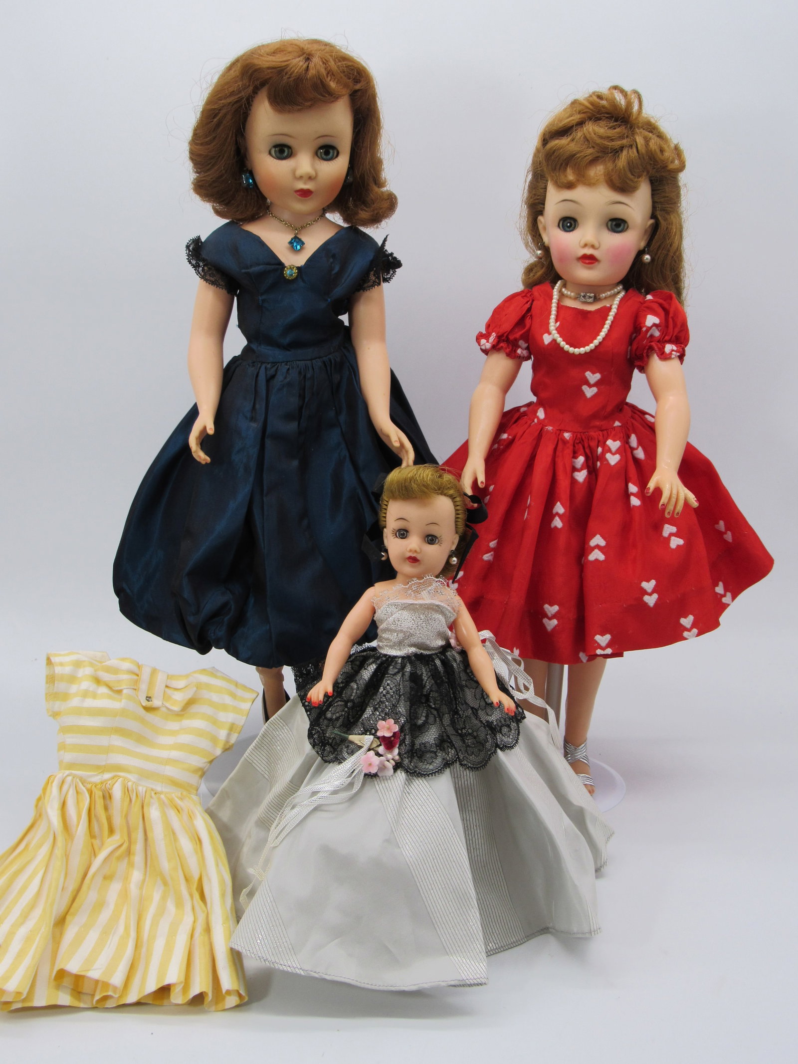 PAIR OF ALEXANDER CHARACTERS:: SOPHISTICATE OR TONI. ORIGINAL DRESS WITH SHOES. 18 IN. IDEAL MISS REVELON ORIGINAL DRESS PLUS EXTRA FACTORY DRESS, BLUSH ENHANCED, TINY NIP ON RIGHT EYELASH, REPAIRED LEFT PINKY & 10 IN. IDEAL LITTLE