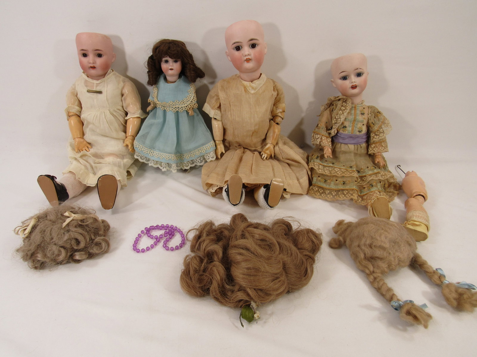 (4) ANTIQUE BISQUE SOCKET HEAD DOLLS: (1 of 20)
